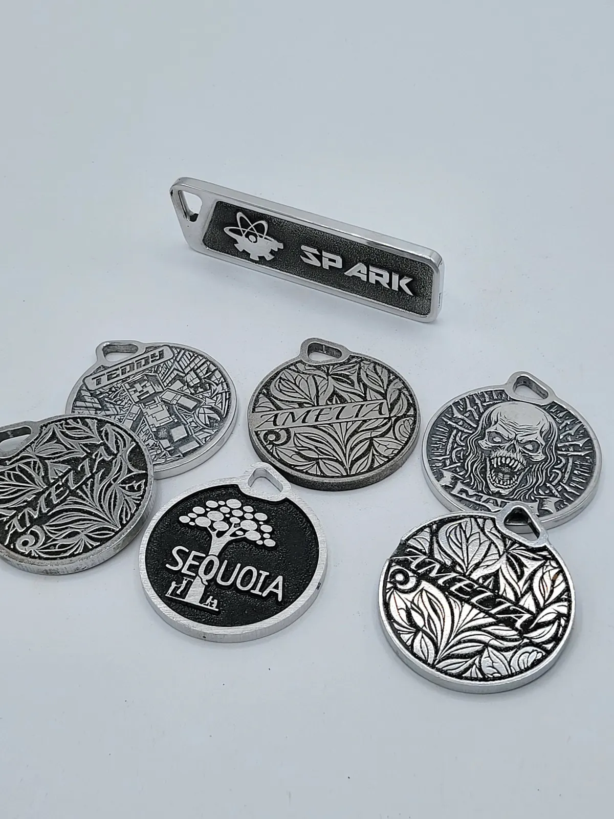 Engraved aluminum medallions, laser work by Spark Fabrication in Richmond, BC